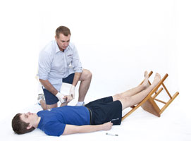 Instructor teaching first aid cardiopulmonary resuscitation course